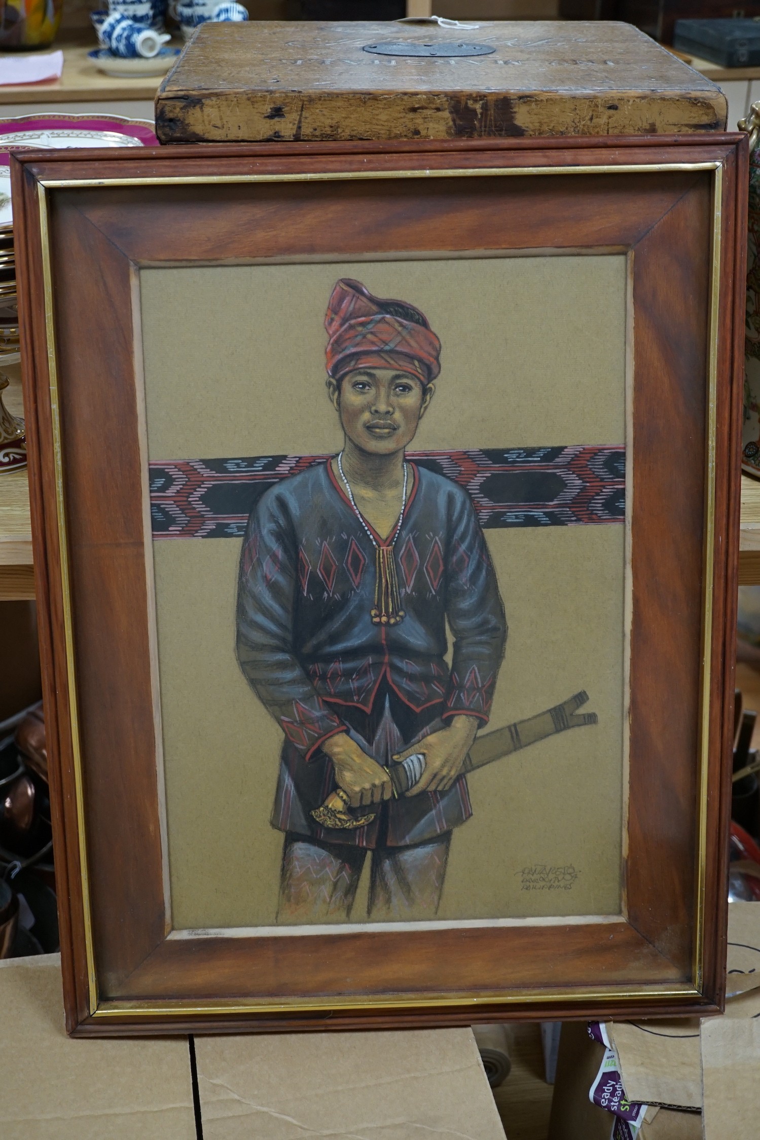 Panareso, pastel, Portrait of a young man holding a kris, signed and inscribed Philippines '04, 48 x 33cm